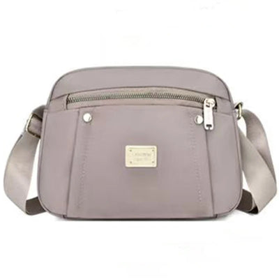 Men and women's cross-body bags are lightweight and multi-layered, perfect for shopping and traveling.